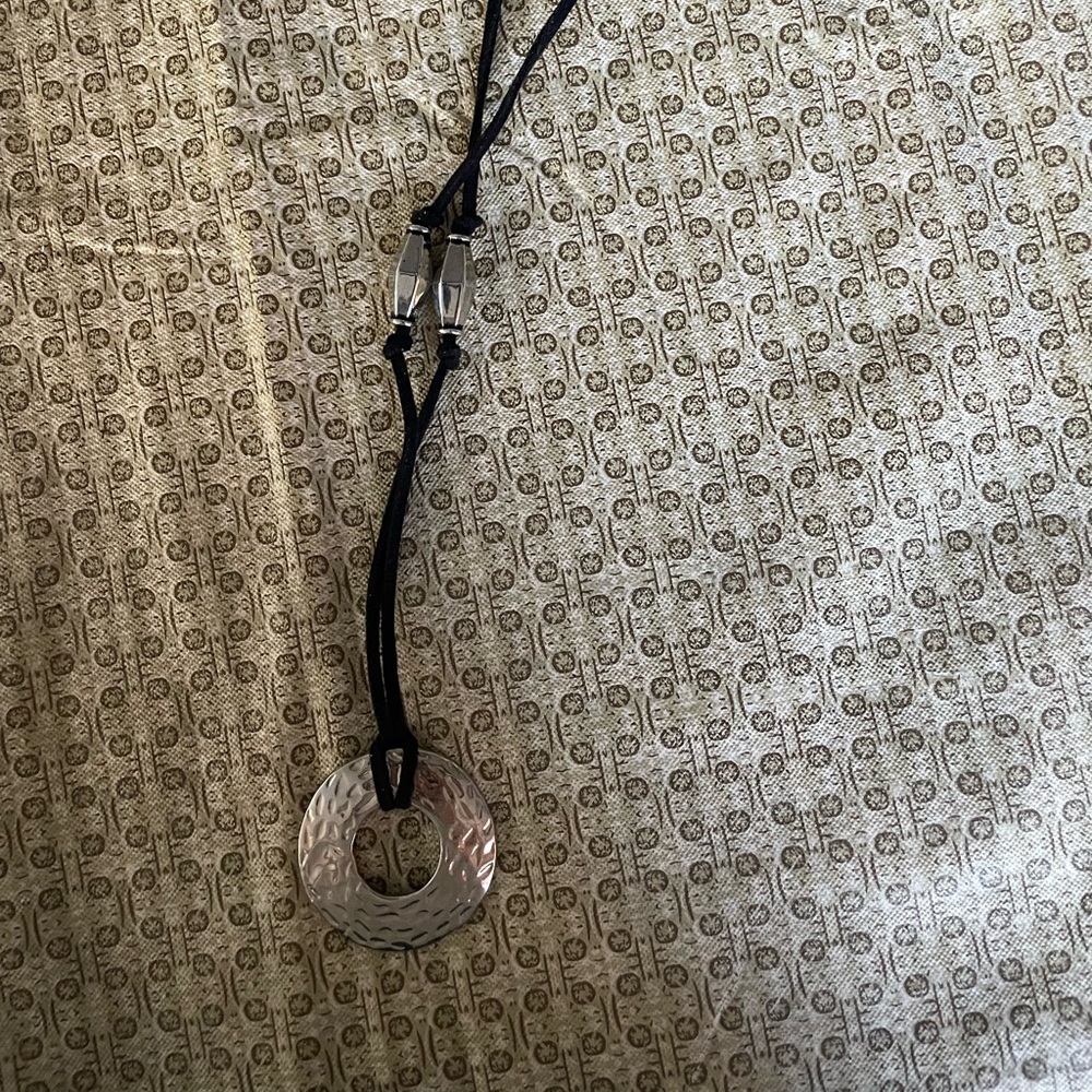 This is a silver hoop necklace